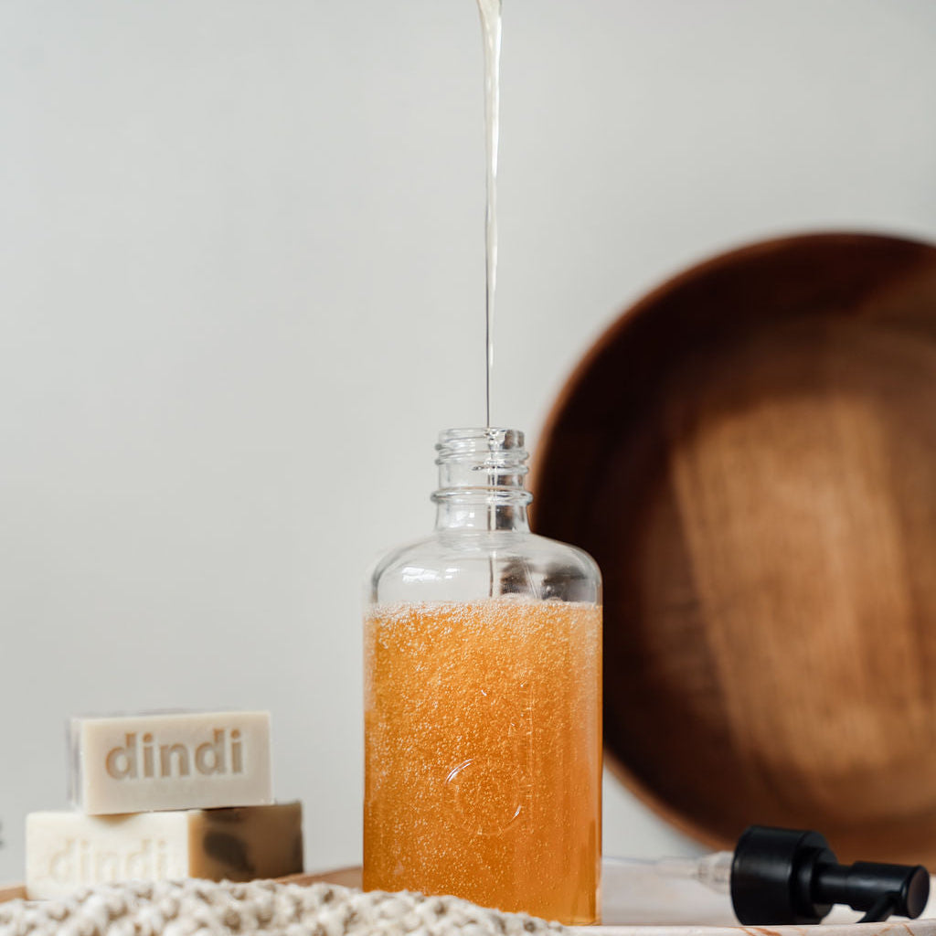 glass dindi bottle bring refilled mostly full